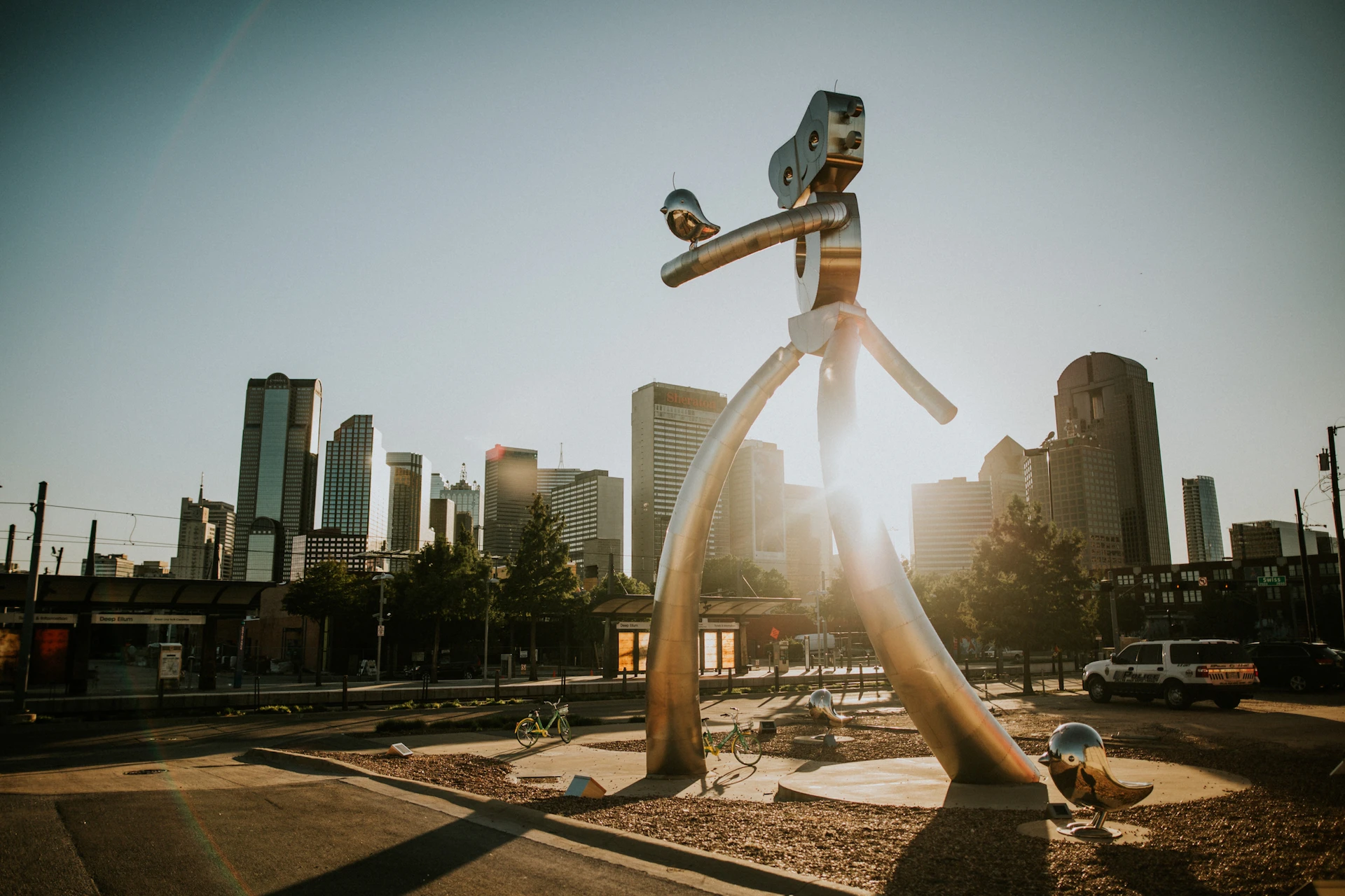 The Traveling Man sculpture and colorful Deep Ellum streetscape in Dallas